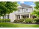 Charming two-story home featuring stone accents, a welcoming porch, and beautifully landscaped front yard at 2898 Violet W Ct, Columbus, IN 47201