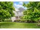 Picturesque two-story home framed by mature trees and a well-maintained lawn at 2898 Violet W Ct, Columbus, IN 47201