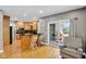 Spacious kitchen with an island, black countertops, and access to the backyard patio at 2898 Violet W Ct, Columbus, IN 47201