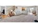Inviting living room with plush sofas, wood flooring, and staircase at 2898 Violet W Ct, Columbus, IN 47201