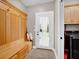 Practical mud room with built-in bench and storage, adjacent to laundry appliances at 2898 Violet W Ct, Columbus, IN 47201