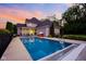 A spacious in-ground pool sits in the backyard of this beautiful home at 2898 Violet W Ct, Columbus, IN 47201