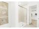 Modern bathroom featuring a glass-enclosed shower, tile surround, and walk-in closet access at 3152 Glasgow Pl, Danville, IN 46122