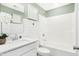 Bright white bathroom featuring a shower-tub combo, modern fixtures, and elegant wall tiles at 3152 Glasgow Pl, Danville, IN 46122