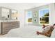 Comfortable bedroom with neighborhood views, complemented by soft lighting and stylish, wood-toned furniture at 3152 Glasgow Pl, Danville, IN 46122
