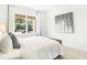 Airy bedroom with a view showcases a neutral palette and plush bedding for ultimate comfort at 3152 Glasgow Pl, Danville, IN 46122