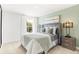 Well-lit bedroom featuring a cozy bed, green wall, and a picturesque window view at 3152 Glasgow Pl, Danville, IN 46122