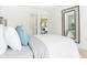 Bright bedroom featuring a decorative mirror and views into the adjacent living area and ensuite closet at 3152 Glasgow Pl, Danville, IN 46122