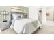 Comfortable bedroom with a green accent wall, plush bedding, and stylish bedside lamps at 3152 Glasgow Pl, Danville, IN 46122