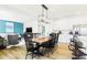 Open concept dining room boasts stylish furnishings, bright light, and views of the connected living room and kitchen at 3152 Glasgow Pl, Danville, IN 46122