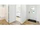 Bright entryway with wood floors, white walls, view of bedroom, and a bathroom visible on the left at 3152 Glasgow Pl, Danville, IN 46122