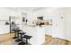Bright kitchen island featuring bar stool seating, stainless steel appliances, and ample white cabinetry at 3152 Glasgow Pl, Danville, IN 46122