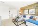 Stylish living room with a modern sofa, striking wood-look wall, and inviting decor accents at 3152 Glasgow Pl, Danville, IN 46122