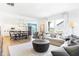 Open-concept living room with a modern interior design, including a dining area and a modern sofa at 3152 Glasgow Pl, Danville, IN 46122