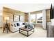 Sophisticated living room showcases a cozy sofa, accent wall, and abundant natural light for a welcoming space at 3152 Glasgow Pl, Danville, IN 46122