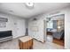Bright kitchen with gray cabinets, stainless appliances and easy access to living room at 318 S Routiers Ave, Indianapolis, IN 46219