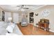 Cozy living room showcasing a gray sofa, recliner, and an open view into the kitchen area at 318 S Routiers Ave, Indianapolis, IN 46219