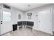 Mud room featuring tile flooring, a corner bench seat, and an exterior door at 318 S Routiers Ave, Indianapolis, IN 46219