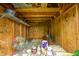 Interior of the shed with plywood walls, filled with storage items and decor at 318 S Routiers Ave, Indianapolis, IN 46219