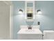 Bathroom featuring a stand-up shower, decorative wall lighting, and a mirror above the sink at 3215 E Edgewood Ave, Indianapolis, IN 46227