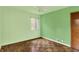 Bedroom with a window and hardwood floors at 3215 E Edgewood Ave, Indianapolis, IN 46227