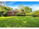Charming brick home surrounded by lush greenery and a well-manicured lawn at 3215 E Edgewood Ave, Indianapolis, IN 46227