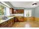 Bright kitchen with wood cabinets, ample counter space, and natural light at 3215 E Edgewood Ave, Indianapolis, IN 46227