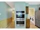 View of kitchen featuring stainless steel appliances and transition to laundry area at 3215 E Edgewood Ave, Indianapolis, IN 46227