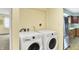 Bright laundry area with modern washer and dryer, conveniently located near the kitchen at 3215 E Edgewood Ave, Indianapolis, IN 46227