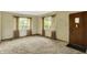 Inviting living room featuring large windows, and a warm, neutral color palette at 3215 E Edgewood Ave, Indianapolis, IN 46227