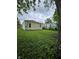 Spacious backyard, partially overgrown, offering great potential for outdoor activities and landscaping at 3305 E 30Th St, Indianapolis, IN 46218