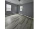 Empty bedroom featuring neutral walls, modern laminate flooring, and bright natural light at 3305 E 30Th St, Indianapolis, IN 46218