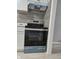 The kitchen features a modern stove and stainless steel appliances at 3305 E 30Th St, Indianapolis, IN 46218