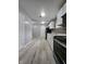 The remodeled kitchen features modern appliances and light wood flooring, adding style and warmth to the space at 3305 E 30Th St, Indianapolis, IN 46218