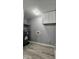 Laundry area featuring a water heater, hook ups, and wood grain flooring at 3305 E 30Th St, Indianapolis, IN 46218