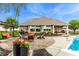 Backyard patio with a swinging bench, seating area, landscaping, and view of the house at 3335 Guilford Ln, Plainfield, IN 46168