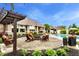 Backyard patio with a swinging bench, seating area, landscaping, and view of the house at 3335 Guilford Ln, Plainfield, IN 46168