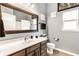 Bathroom featuring a modern vanity, framed mirror, and neutral color scheme, creating a serene and stylish space at 3335 Guilford Ln, Plainfield, IN 46168