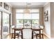 Bright dining room with wood table, large window overlooking the pool, and sliding door access to the patio at 3335 Guilford Ln, Plainfield, IN 46168
