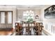 Formal dining room with hardwood floors, crown molding, and views of the landscaped backyard at 3335 Guilford Ln, Plainfield, IN 46168
