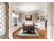 Elegant dining room featuring wainscoting, a large window, and a stylish chandelier at 3335 Guilford Ln, Plainfield, IN 46168