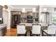 Beautiful kitchen featuring granite counters, stainless appliances, wood floors, and an island with breakfast bar at 3335 Guilford Ln, Plainfield, IN 46168