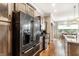 Well-equipped kitchen featuring stainless steel appliances, wood cabinets, and a view into the dining area at 3335 Guilford Ln, Plainfield, IN 46168