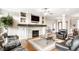 Inviting living room with a fireplace, hardwood floors, and comfortable seating at 3335 Guilford Ln, Plainfield, IN 46168
