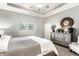 Bright main bedroom showcases neutral colors, a full dresser, and large windows, creating a serene retreat at 3335 Guilford Ln, Plainfield, IN 46168