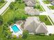 Aerial shot of a backyard featuring a pool, firepit, and outdoor seating at 3335 Guilford Ln, Plainfield, IN 46168