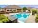 Lovely backyard pool and patio with ample lounge seating, well-maintained landscaping, and lush greenery at 3335 Guilford Ln, Plainfield, IN 46168