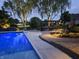 Inviting pool with an outdoor patio area featuring comfortable seating, a pergola, and ambient lighting at 3335 Guilford Ln, Plainfield, IN 46168