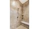 Shower features tiled walls, a built-in bench, and modern fixtures for a luxurious bathing experience at 3335 Guilford Ln, Plainfield, IN 46168