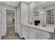 Bright bathroom featuring double sink vanity with stone countertop, large mirror and open door to walk-in closet at 3449 Glasgow Pl, Danville, IN 46122